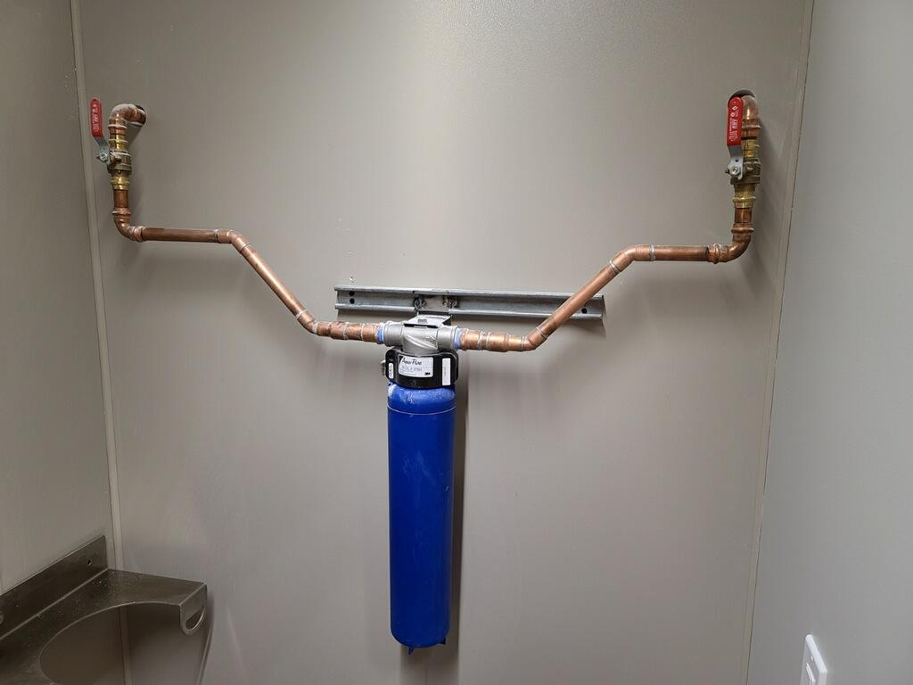 Copper pipework and whole-house water filter installed by Eddy's Plumbing